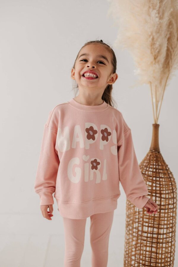 Smiling girl in pink outfit with 'Happy Girl' text.