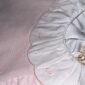 Pink baby dress with embroidered collar details.