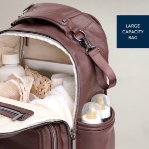 Open diaper bag with bottles and supplies visible.