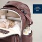 Open diaper bag with bottles and supplies visible.