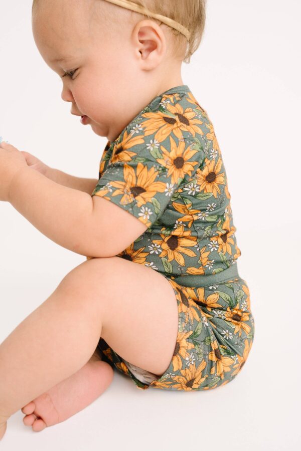Baby wearing sunflower pattern outfit