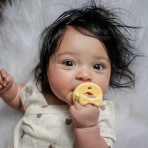 Baby chewing on a teething toy