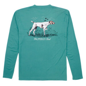 Green shirt with dog and grass design