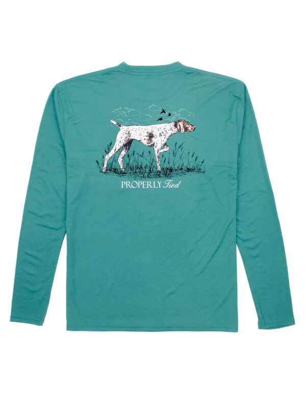 Green shirt with dog and grass design