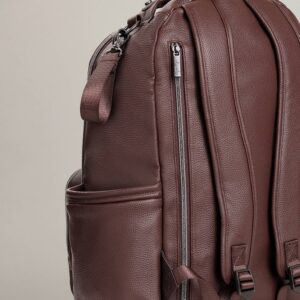 Brown leather backpack with side pockets and zippers.