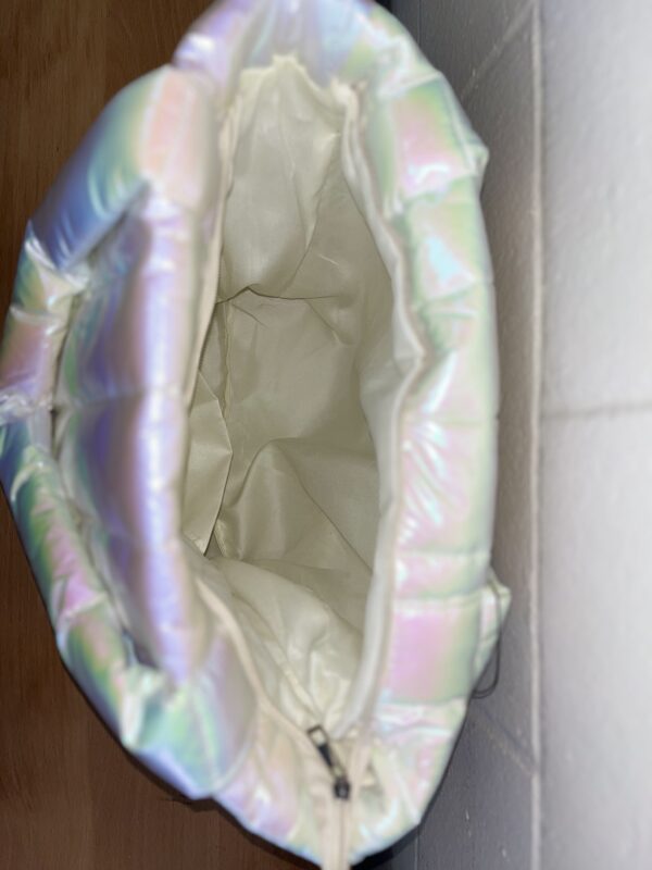 Open iridescent puffer bag on side view