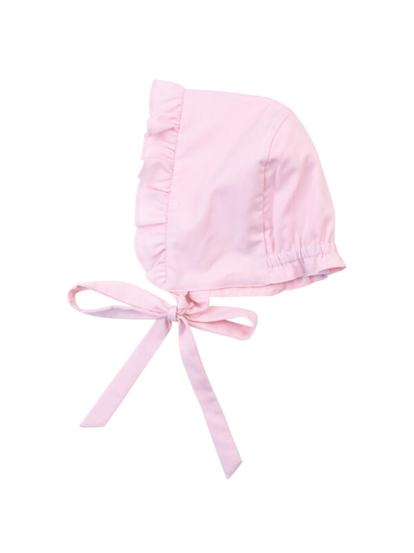 Pink baby bonnet with ruffled trim and ties.