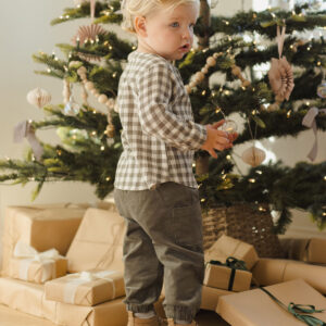 Child with Christmas tree and presents