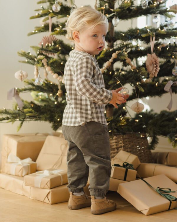 quincy mae luca corduroy pants forest Child with Christmas tree and presents