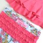 Pink ruffled floral swimsuit for girls.