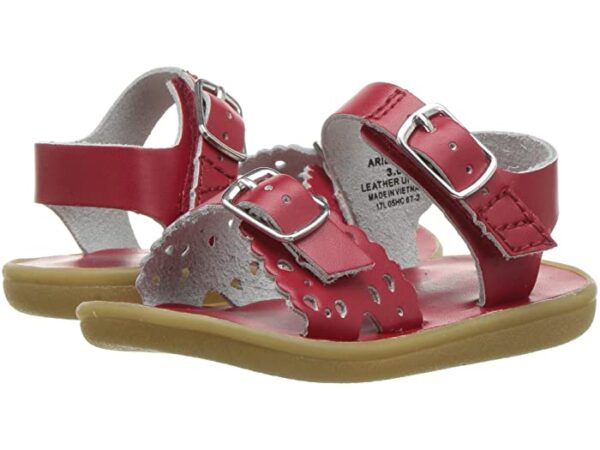 Red toddler sandals with buckles and perforated design.