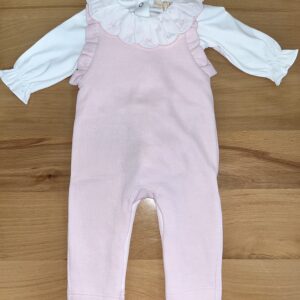 Pink baby romper with white ruffled collar.