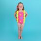 Child wearing colorful swimsuit with sun design