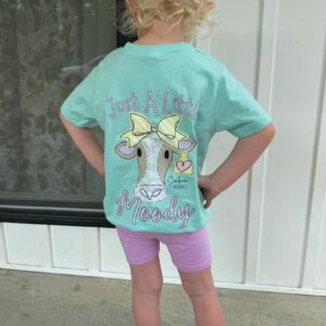 Child wearing Moody cow shirt with bows