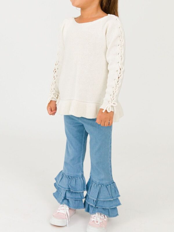 rufflebutts ruffle flare denim jeggings Child wearing white sweater and ruffled jeans.