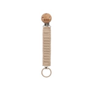 Beige pacifier clip with wooden clasp.