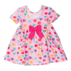 Pink dress with heart patterns and bow