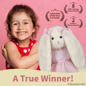 Smiling girl with award-winning stuffed bunny.