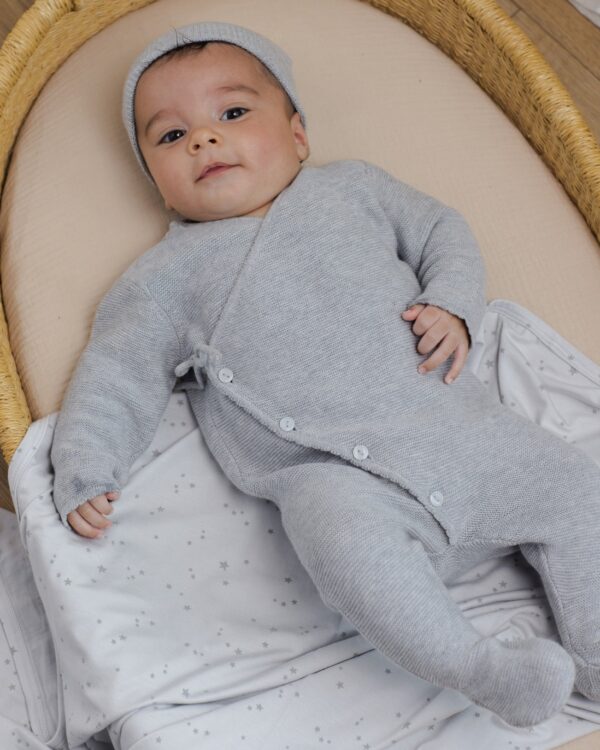 quincy mae wrap knit footie heathered dusty blue Baby in gray onesie on soft blanket