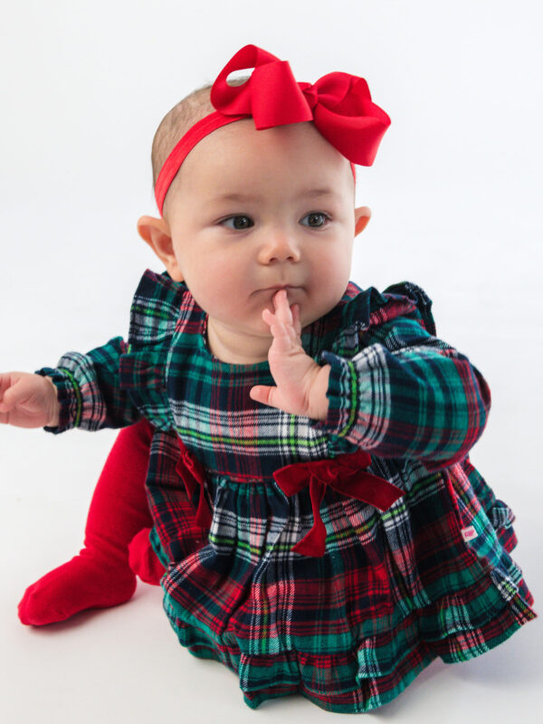 rufflebutts woven long sleeve waterfall bow swing top & bloomer set Baby in plaid dress with red bow headband.