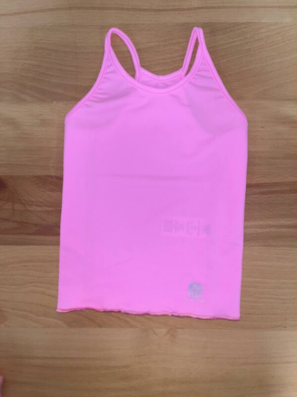 yoga baby bubblegum razor back tank Pink tank top on wooden surface.