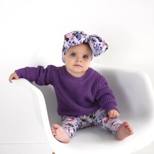 Baby in purple sweater and floral headband
