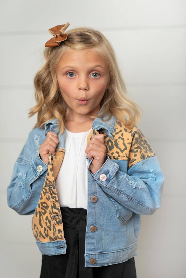 oopsie daisy kids leopard patch & light wash denim button pocket jacket Child in denim leopard jacket making funny face.