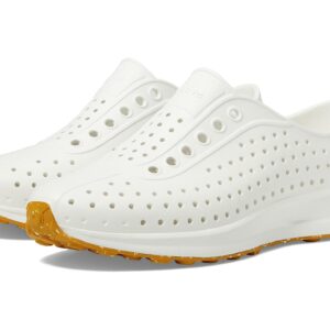 White perforated slip-on shoes with yellow sole.