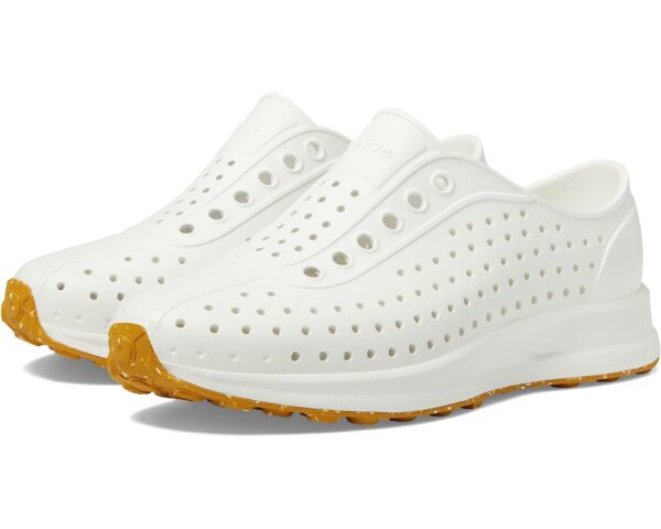 White perforated slip-on shoes with yellow sole.