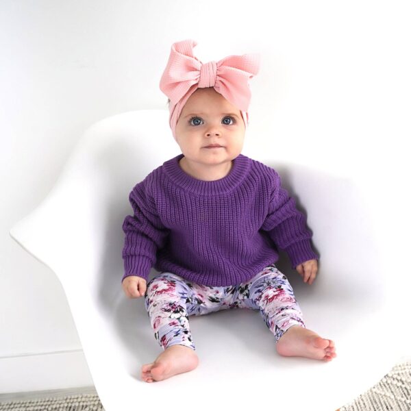 gigi and max emerson legging and sweater set Baby in purple sweater, floral leggings, pink headband.