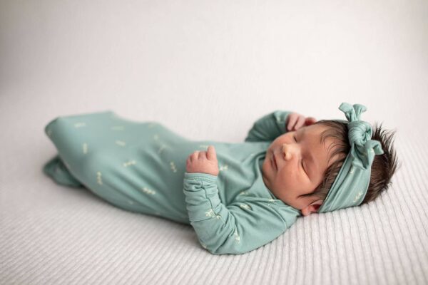 three little tots arrow print knotted newborn baby gown pajamas Newborn baby in green outfit sleeping peacefully