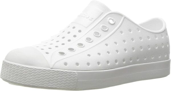 White slip-on sneaker with perforated design.