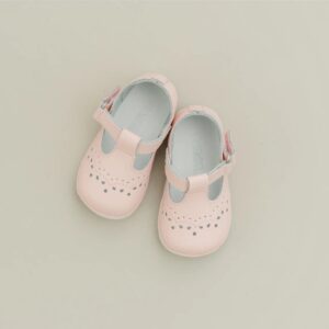 Pink baby shoes with cutout design