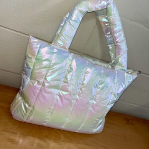 Iridescent puffer tote bag on wooden surface.