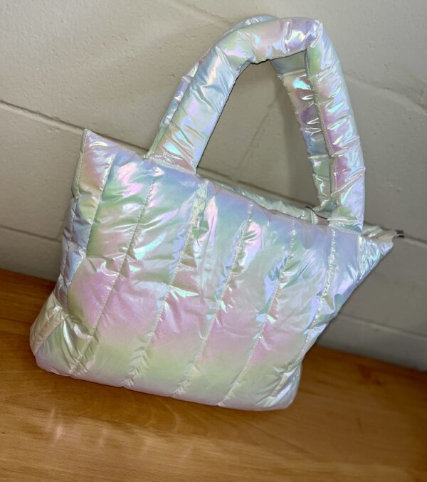 ml kids iridescent white overnight bag Iridescent puffer tote bag on wooden surface.
