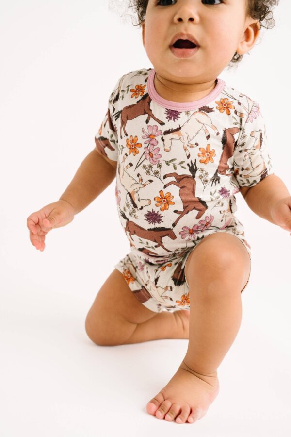 little one shop prairie ponies bamboo shorts set Baby in floral horse-patterned outfit crawling