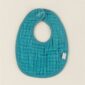 Teal baby bib with snap buttons.