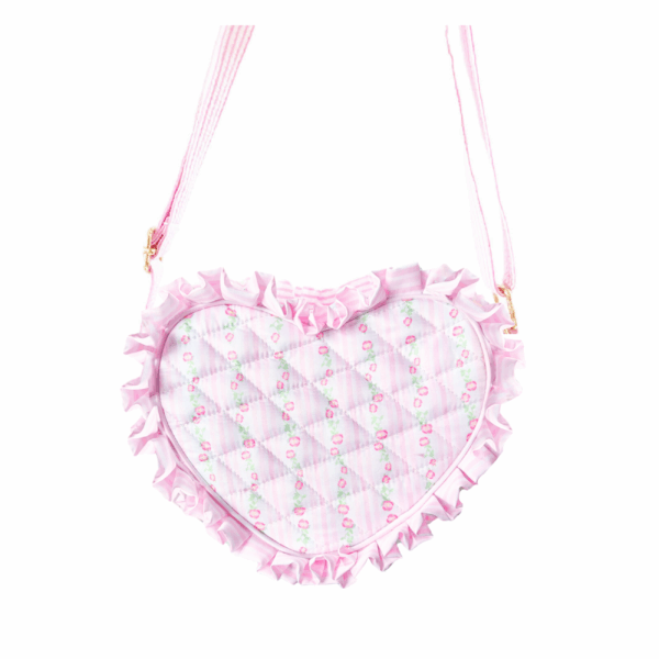 bits & bows floral quilted heart purse Heart-shaped pink bag with floral pattern and ruffles.