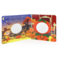 Children's Halloween book with pumpkins and cutouts.