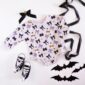 Halloween-themed baby outfit with bats and bows.