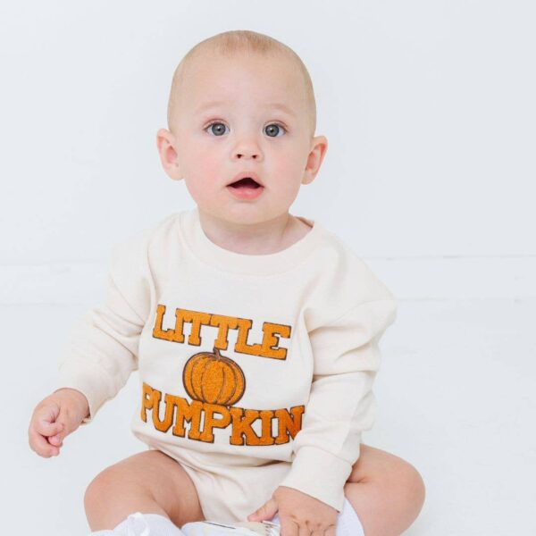 sweet wink little pumpkin patch long sleeve romper unisex Baby wearing 'Little Pumpkin' outfit, sitting indoors.