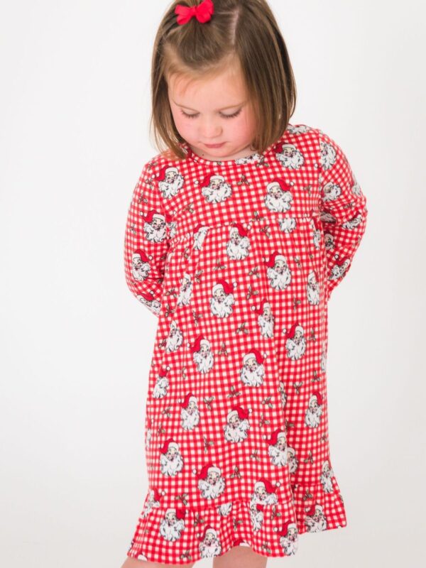 rufflebutts gingham plaid santa pajamas bamboo ruffled gown Child in red Santa dress and bow.