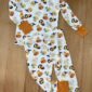 Halloween-themed children's pajamas with pumpkin and duck prints.