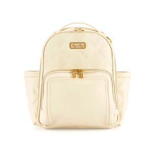 Cream quilted diaper backpack with front pockets.