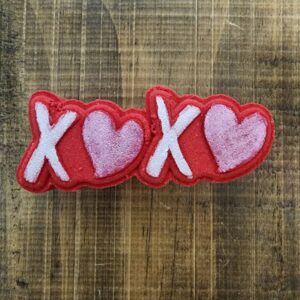 XOXO red rug on wooden floor