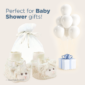 Baby shower gift bag, lamb booties, balloons, and present.