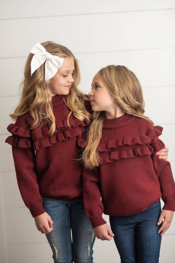 oopsie daisy kids wine double ruffle crew neck fall winter sweater Two girls in matching burgundy sweaters hugging.