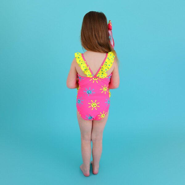 gigi and max brittany smiley face tank one piece swimsuit Child in colorful swimsuit against blue background