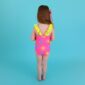 Child in colorful swimsuit against blue background