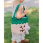 Child carrying pumpkin-themed trick-or-treat bag outside.
